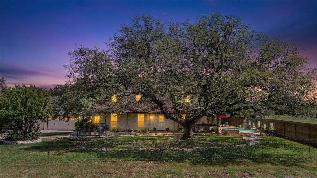 1311 Williamson Road Granbury, TX 76048 - Photo 1 of 40 a backyard of a house with lots of green space