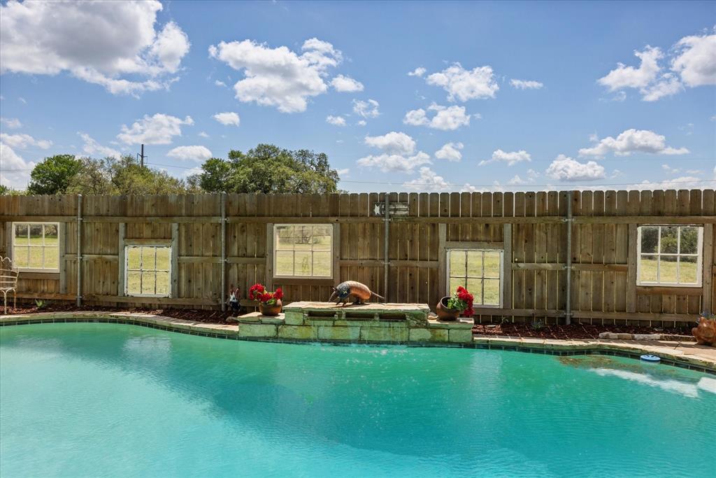 1311 Williamson Road Granbury, TX 76048 - Photo 11 of 40 a garden view with a sitting space