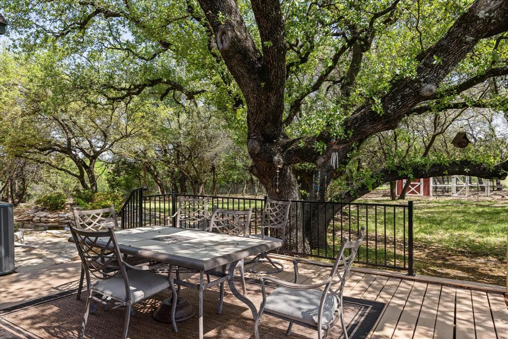 1311 Williamson Road Granbury, TX 76048 - Photo 14 of 40 a view of backyard with a table and chairs