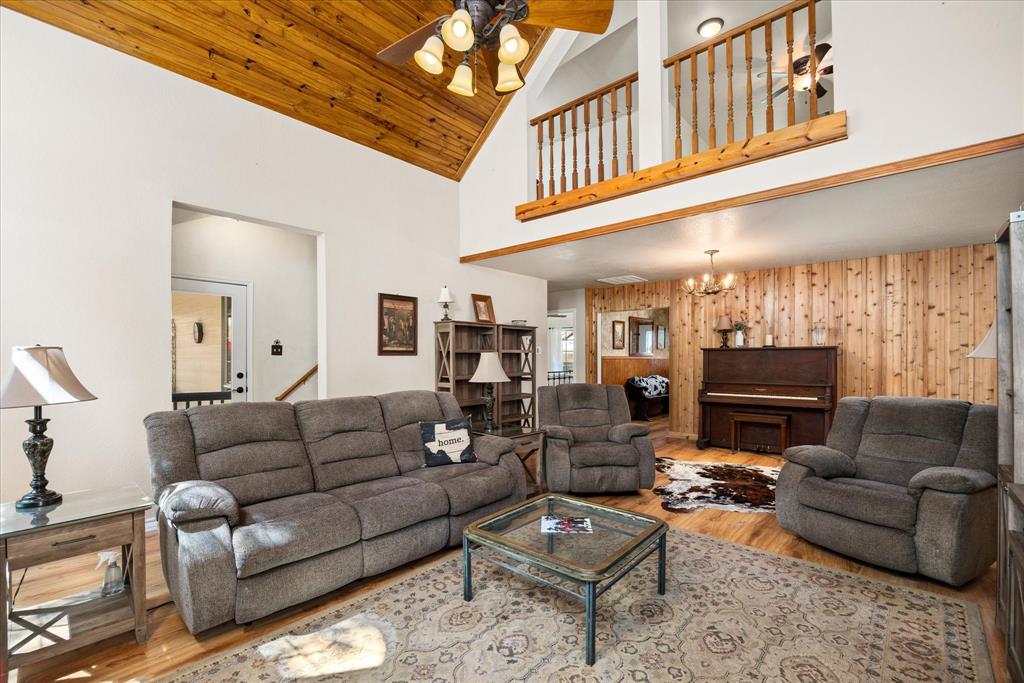 1311 Williamson Road Granbury, TX 76048 - Photo 18 of 40 a living room with furniture a ceiling fan and a rug