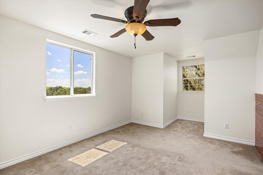 1311 Williamson Road Granbury, TX 76048 - Photo 33 of 40 a view of an empty room with a window