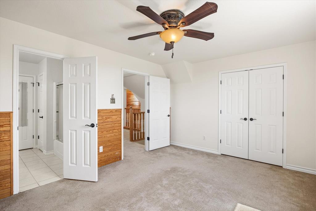 1311 Williamson Road Granbury, TX 76048 - Photo 34 of 40 an empty room with closet and a ceiling fan