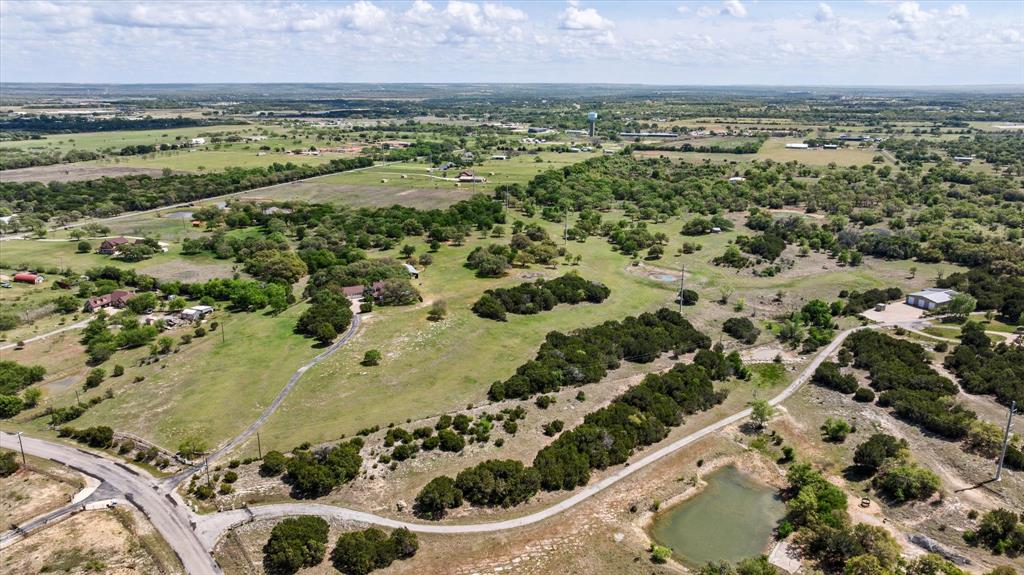 1311 Williamson Road Granbury, TX 76048 - Photo 35 of 40 an aerial view of a residential houses with outdoor space