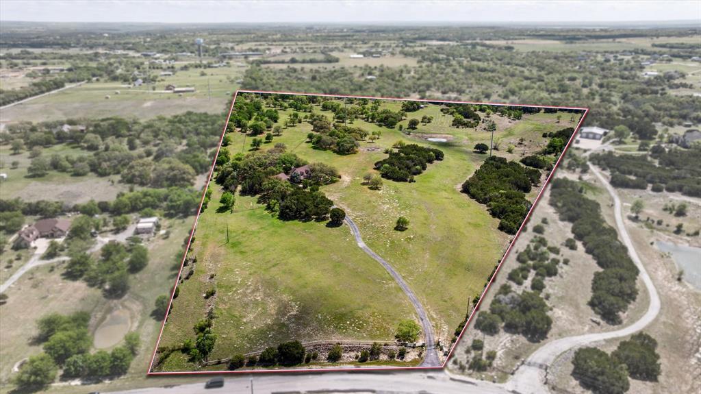 1311 Williamson Road Granbury, TX 76048 - Photo 10 of 40 an aerial view of residential houses with outdoor space