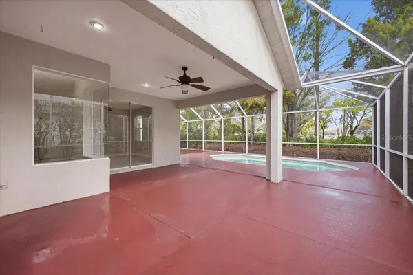 a view of an empty room with a floor to ceiling window and stairs