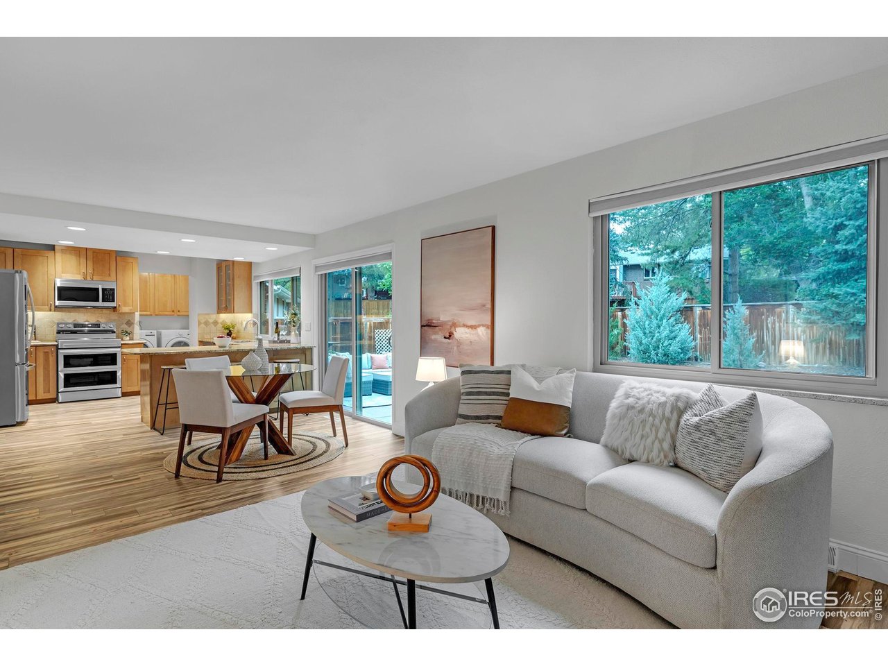 4636 Devonshire Street Boulder, CO 80301 - Photo 12 of 40 a living room with furniture and a large window
