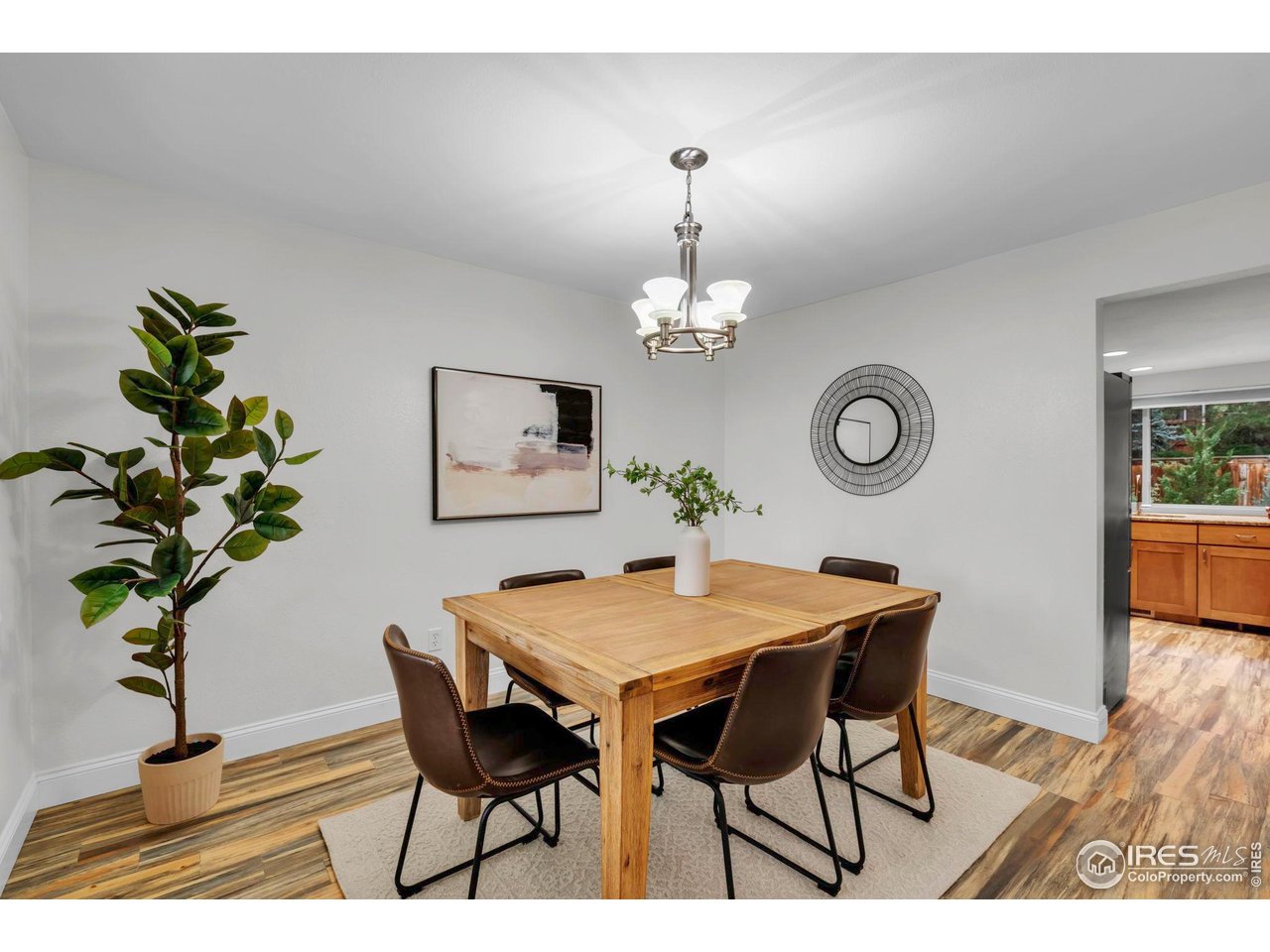 4636 Devonshire Street Boulder, CO 80301 - Photo 14 of 40 a view of a dining room with furniture and wooden floor