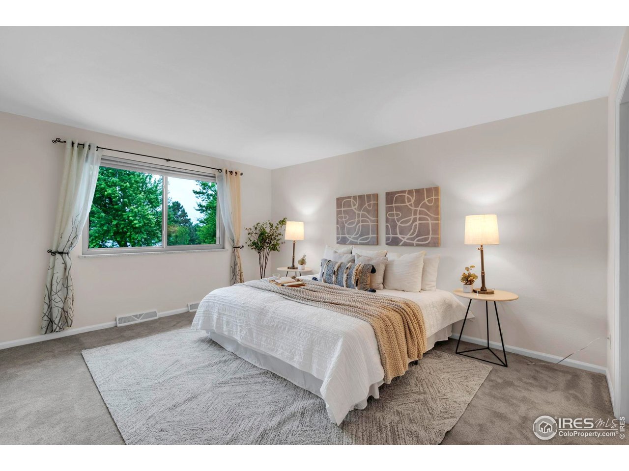 4636 Devonshire Street Boulder, CO 80301 - Photo 18 of 40 a bedroom with a bed and a window