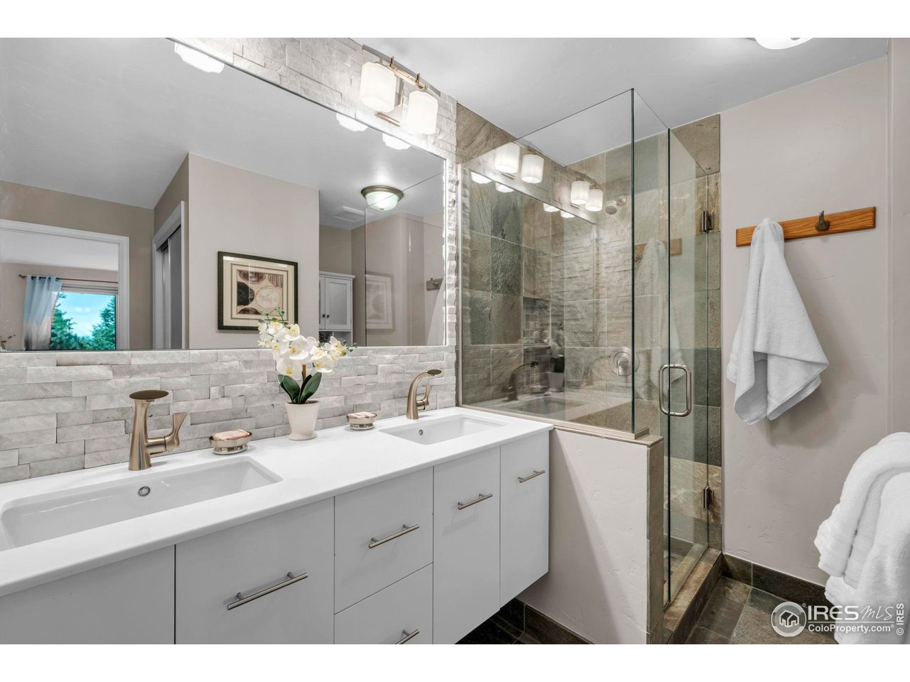 4636 Devonshire Street Boulder, CO 80301 - Photo 20 of 40 a bathroom with a double vanity sink mirror and double
