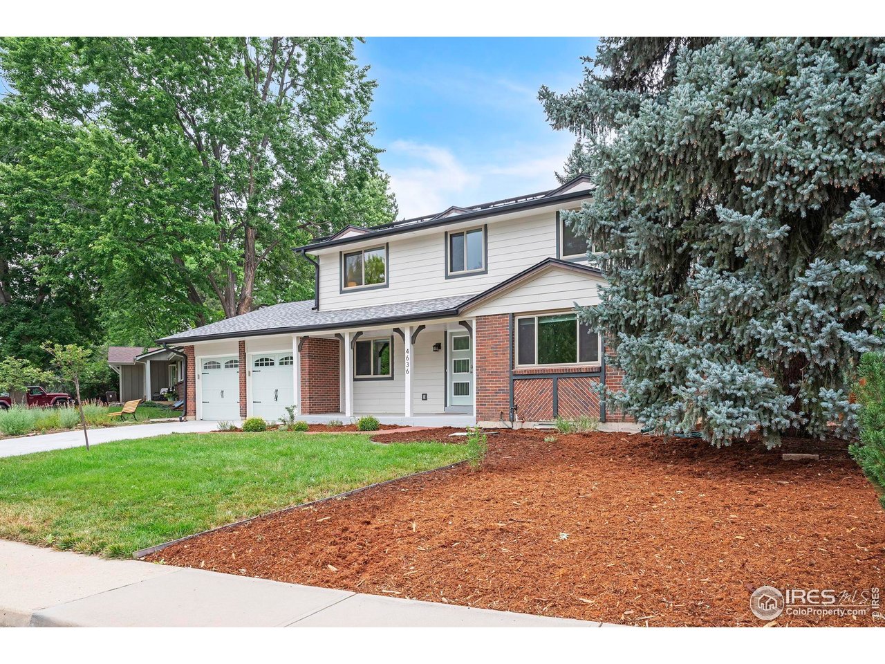 4636 Devonshire Street Boulder, CO 80301 - Photo 2 of 40 a front view of a house with a garden