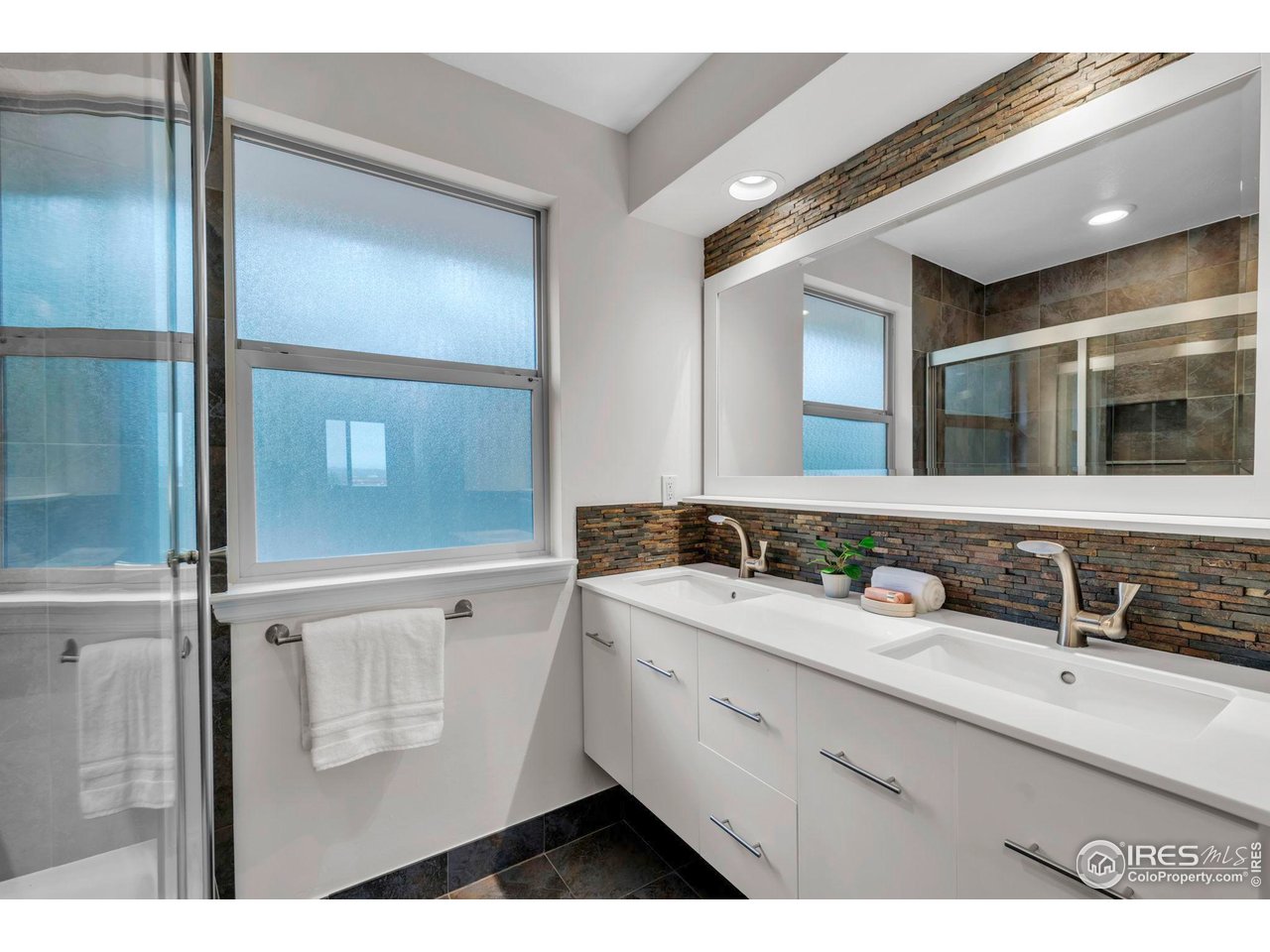 4636 Devonshire Street Boulder, CO 80301 - Photo 21 of 40 a bathroom with a sink and a mirror