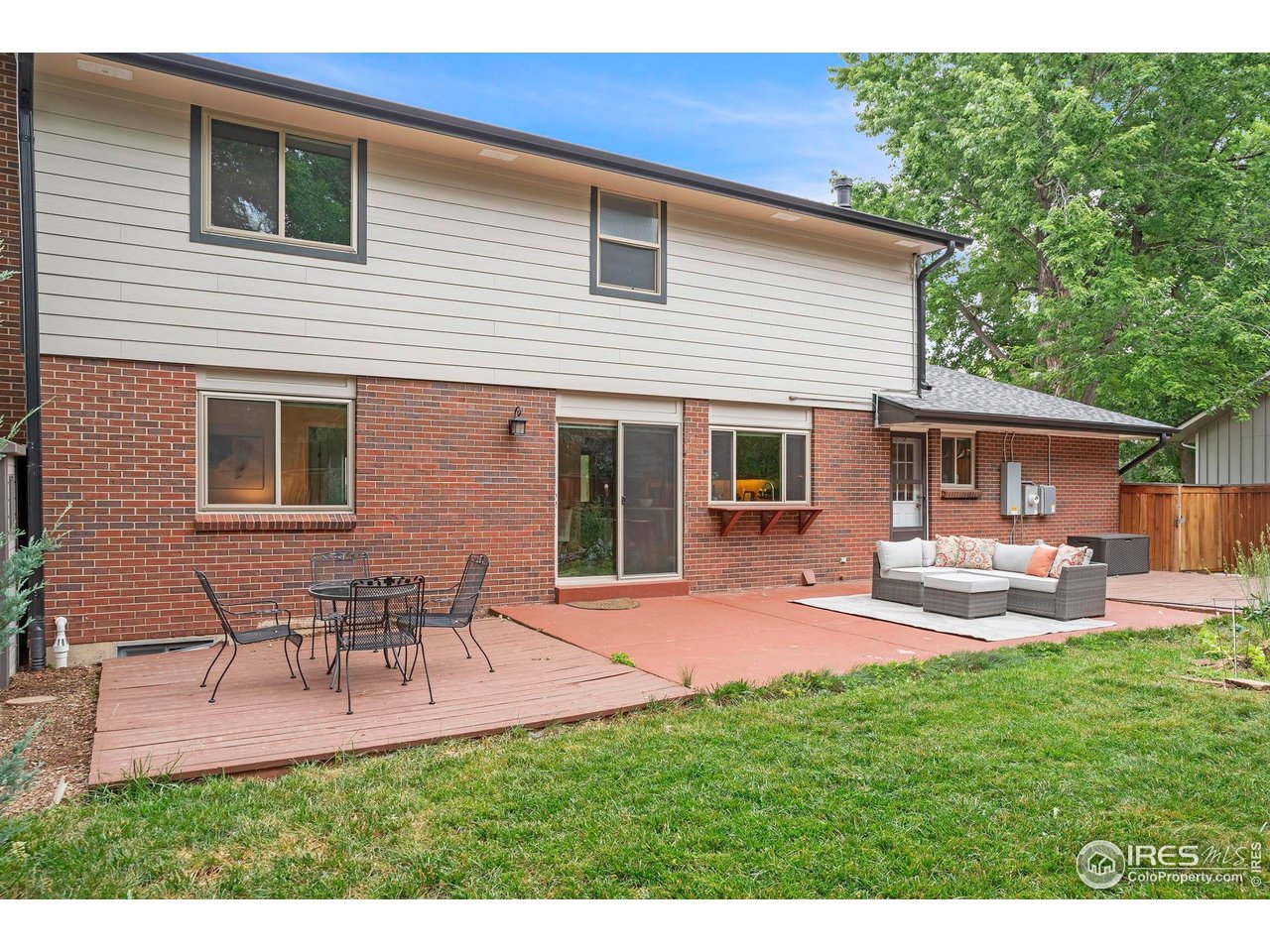 4636 Devonshire Street Boulder, CO 80301 - Photo 32 of 40 a front view of house with a garden and patio