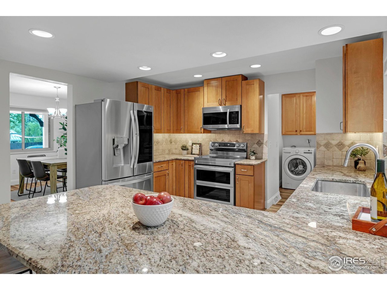 4636 Devonshire Street Boulder, CO 80301 - Photo 7 of 40 a kitchen with a refrigerator and a sink
