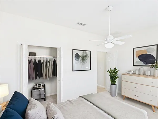 a view of an empty room with a fan