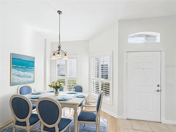 a dining room with furniture and window