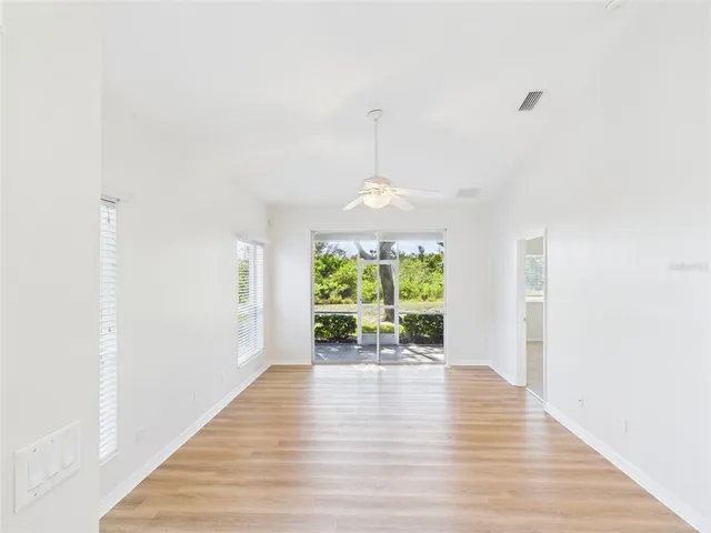 a view of an empty room with a fan