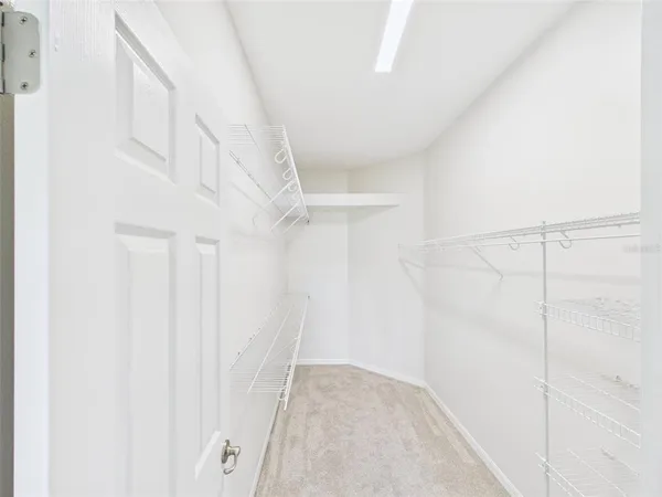 a view of staircase with white walls