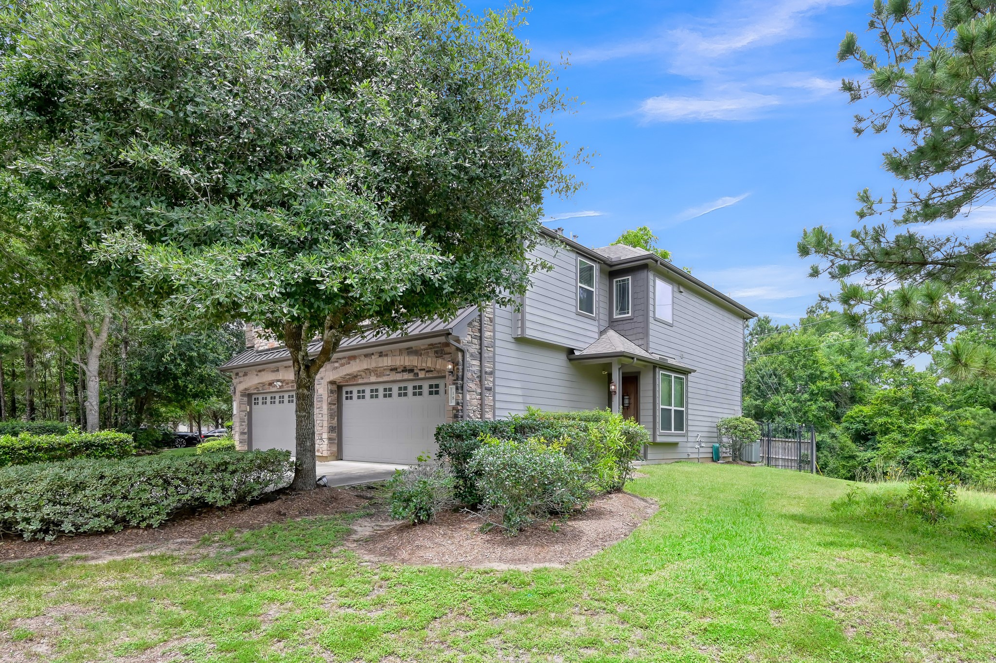 18 Aventura Place Spring, TX 77389 - Photo 6 of 43 a front view of a house with a yard