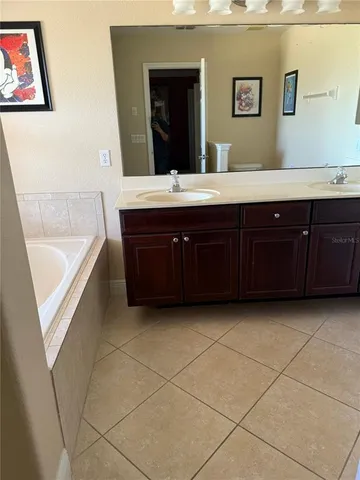 a bathroom with a sink and mirror