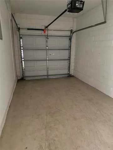 a view of an empty room with empty shelves