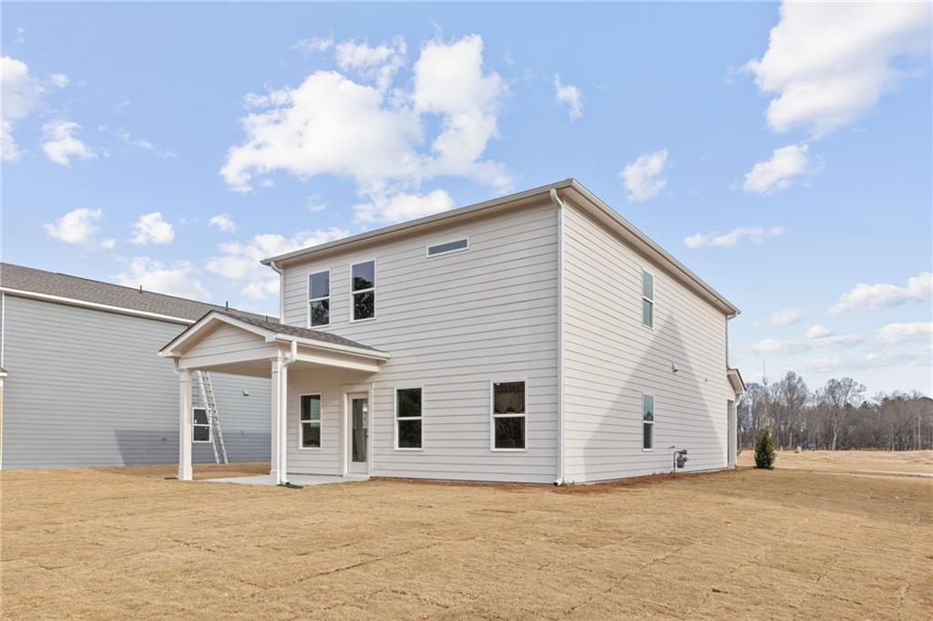 181 Atlas Lane Winder, GA 30680 - Photo 19 of 20 a view of a white house with a yard