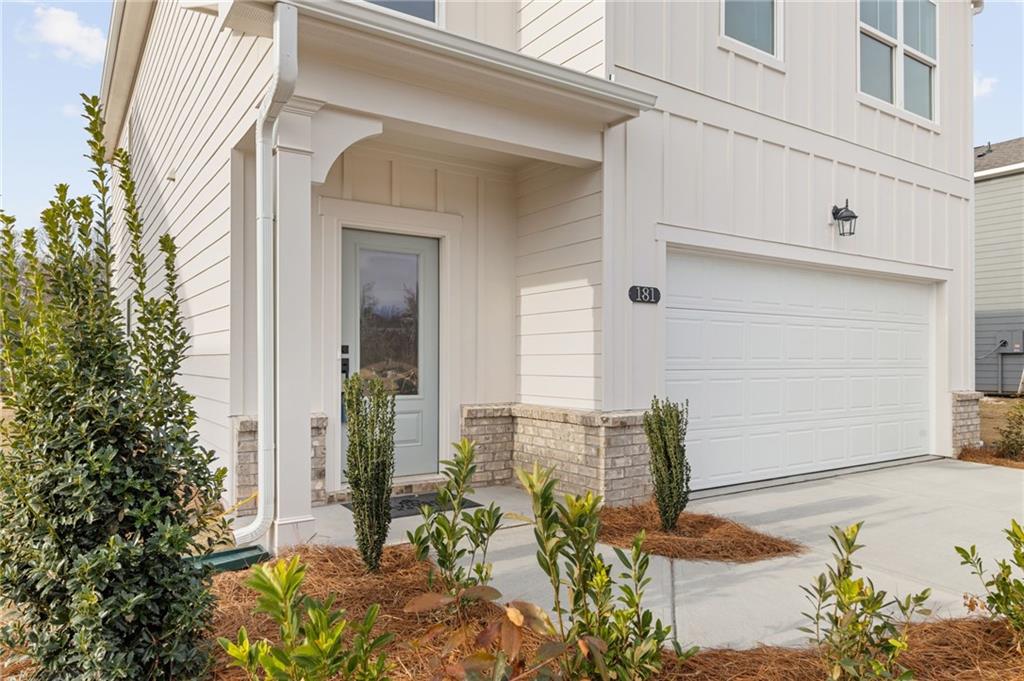 181 Atlas Lane Winder, GA 30680 - Photo 2 of 20 front view of a house with a potted plant