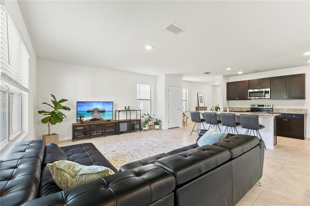 3090 Timber Hawk Circle Ocoee, FL 34761 - Photo 14 of 54 a living room with furniture and a flat screen tv