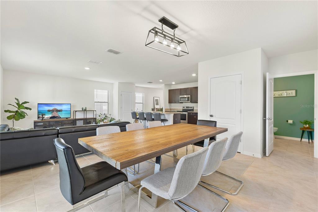 3090 Timber Hawk Circle Ocoee, FL 34761 - Photo 18 of 54 a dining room with a table and chairs