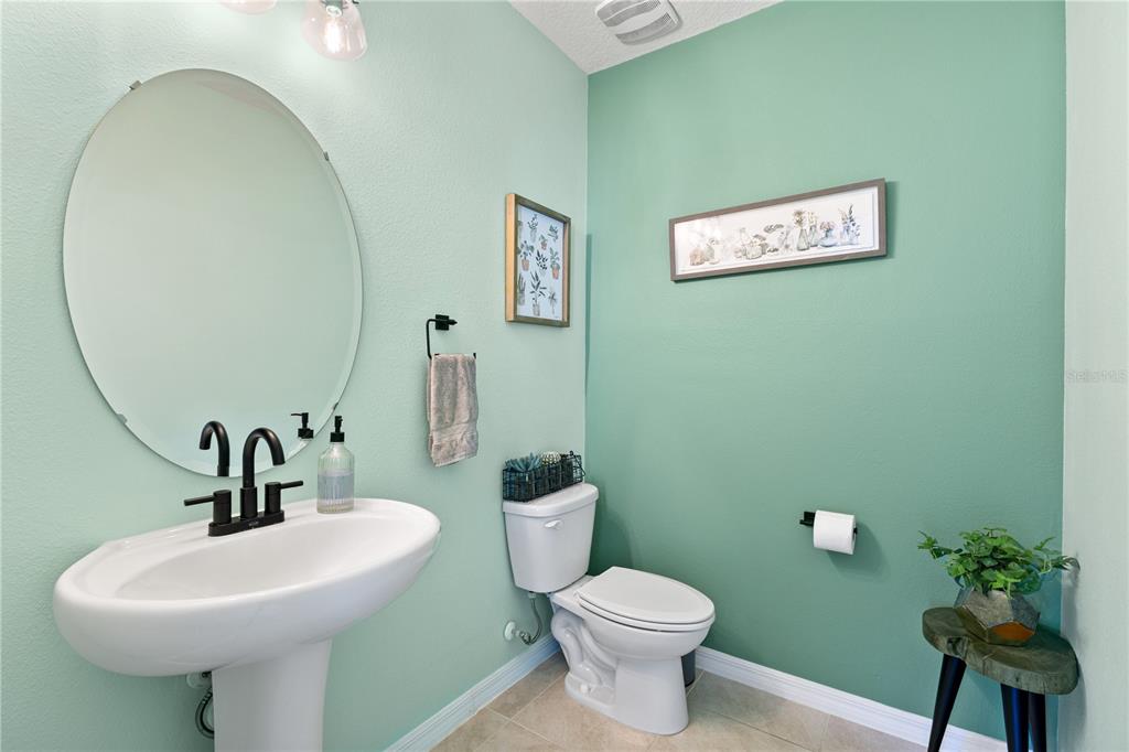 3090 Timber Hawk Circle Ocoee, FL 34761 - Photo 19 of 54 a bathroom with a toilet sink and mirror
