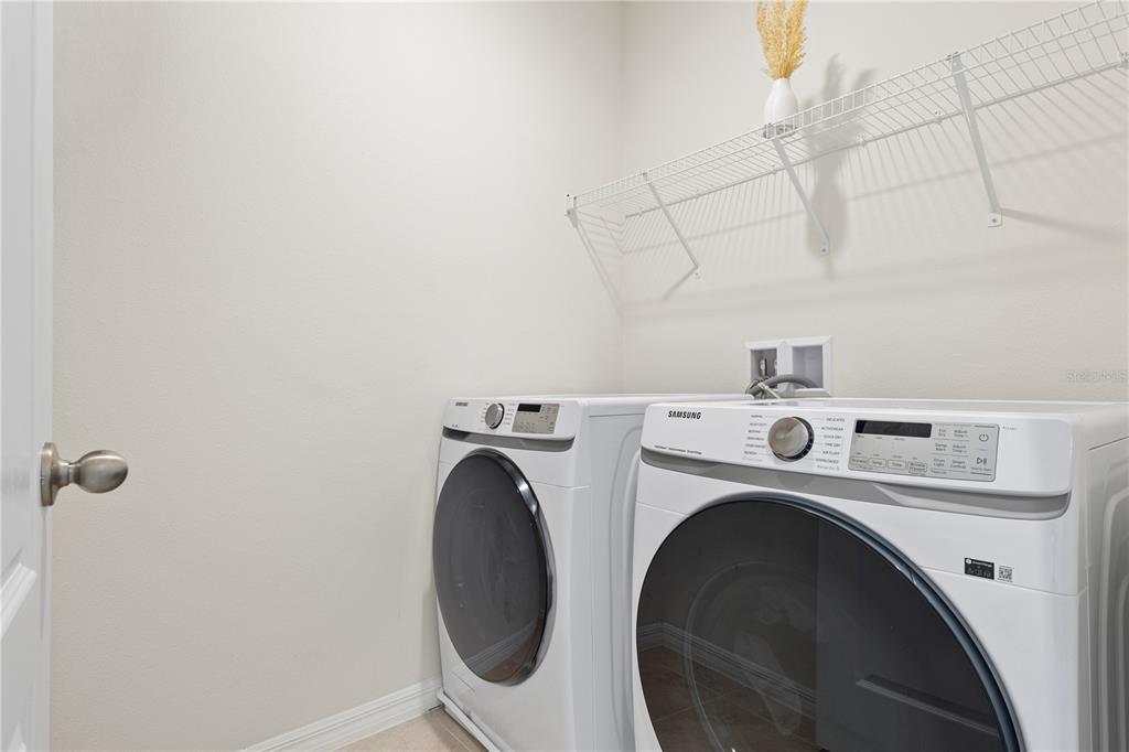 3090 Timber Hawk Circle Ocoee, FL 34761 - Photo 30 of 54 a utility room with dryer and washer