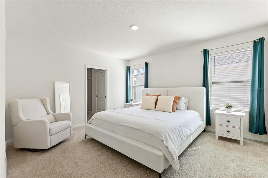 3090 Timber Hawk Circle Ocoee, FL 34761 - Photo 33 of 54 a bedroom with a bed and a couch