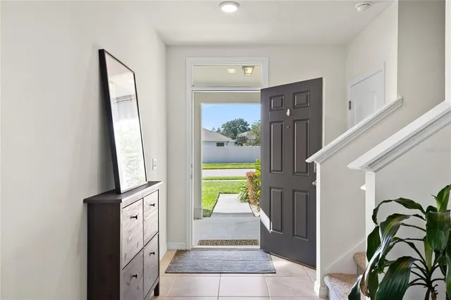 a hallway with painting of the potted plant