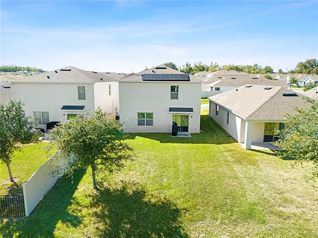 an aerial view of a house with a garden