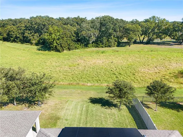 an aerial view of a house with a ocean view