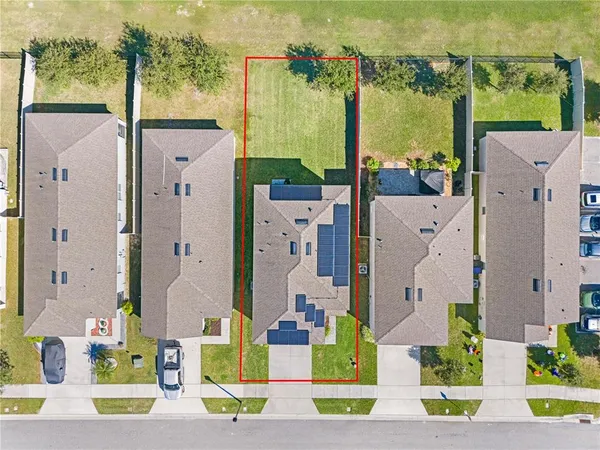 an aerial view of a house with a swimming pool