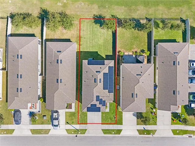 an aerial view of a house with a swimming pool