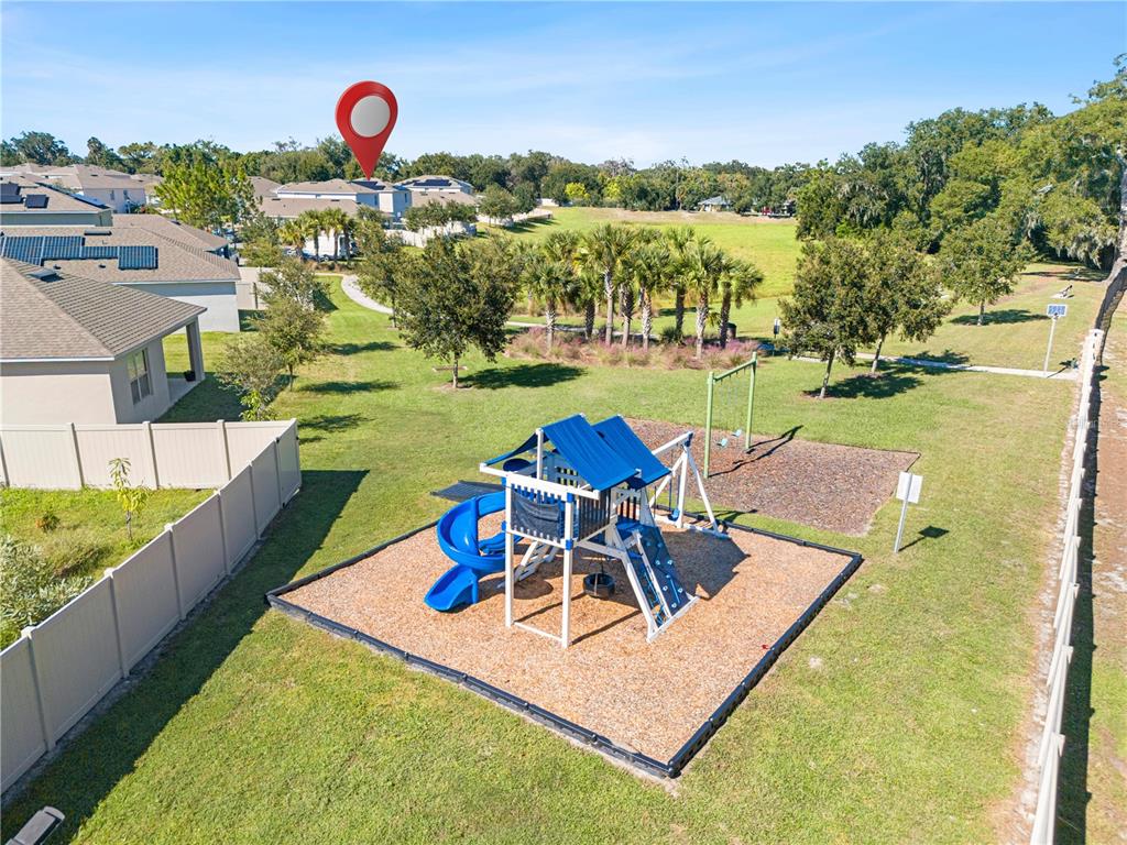 3090 Timber Hawk Circle Ocoee, FL 34761 - Photo 52 of 54 a view of a table and chairs in the garden