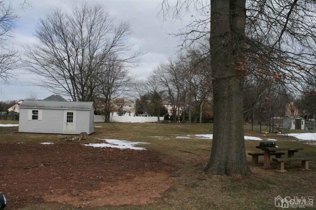 1120 New Dover Road Edison, NJ 08820 - Photo 2 of 9 a view of a house with a yard covered with snow