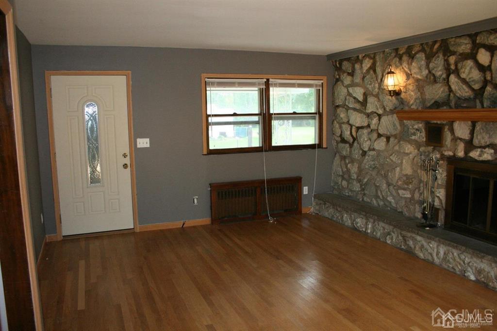 1120 New Dover Road Edison, NJ 08820 - Photo 5 of 9 wooden floor in an empty room with a window