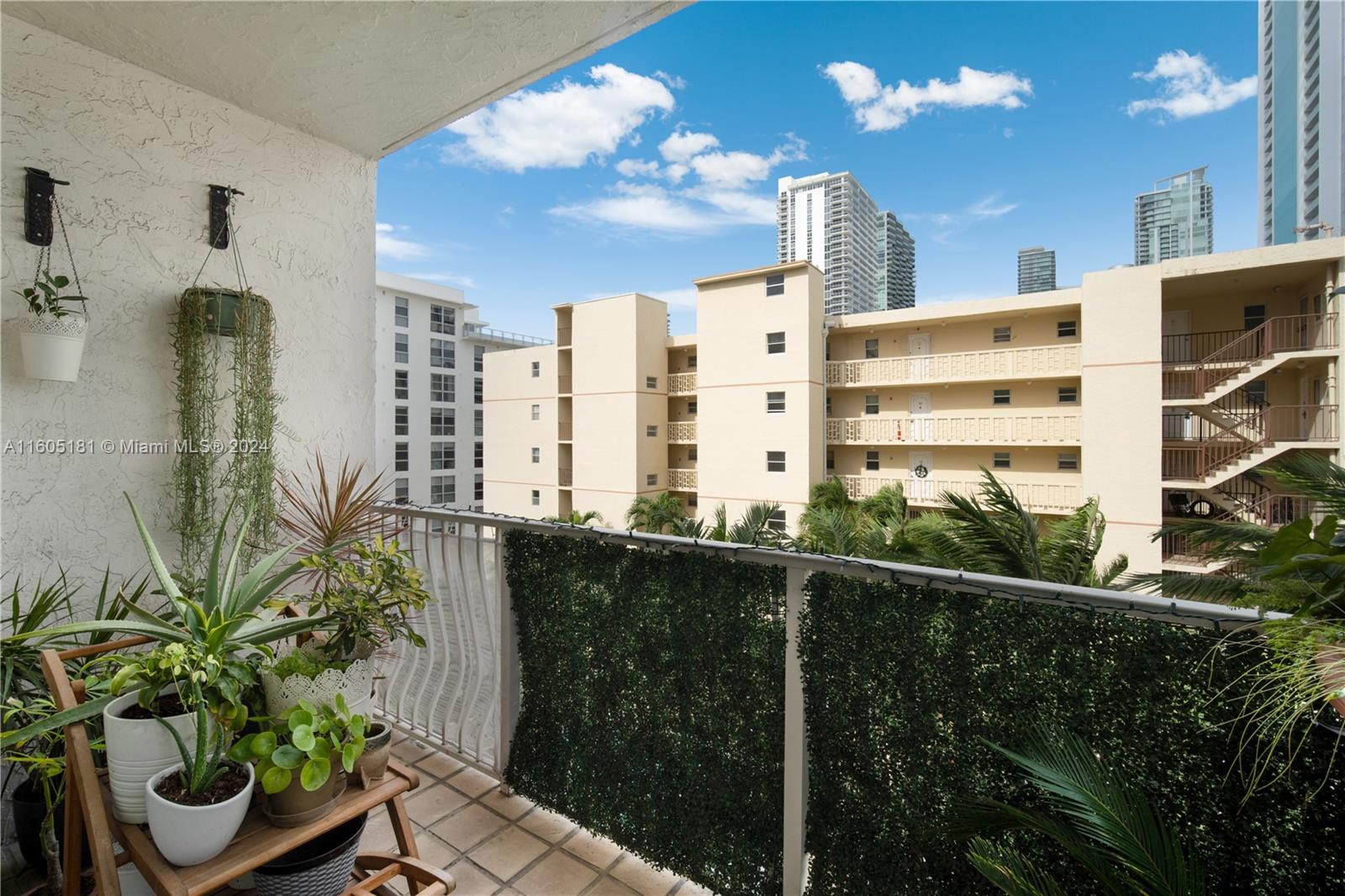 677 Northeast 24th Street, Unit 505 Miami, FL 33137 - Photo 18 of 30 a view of a balcony with potted plants