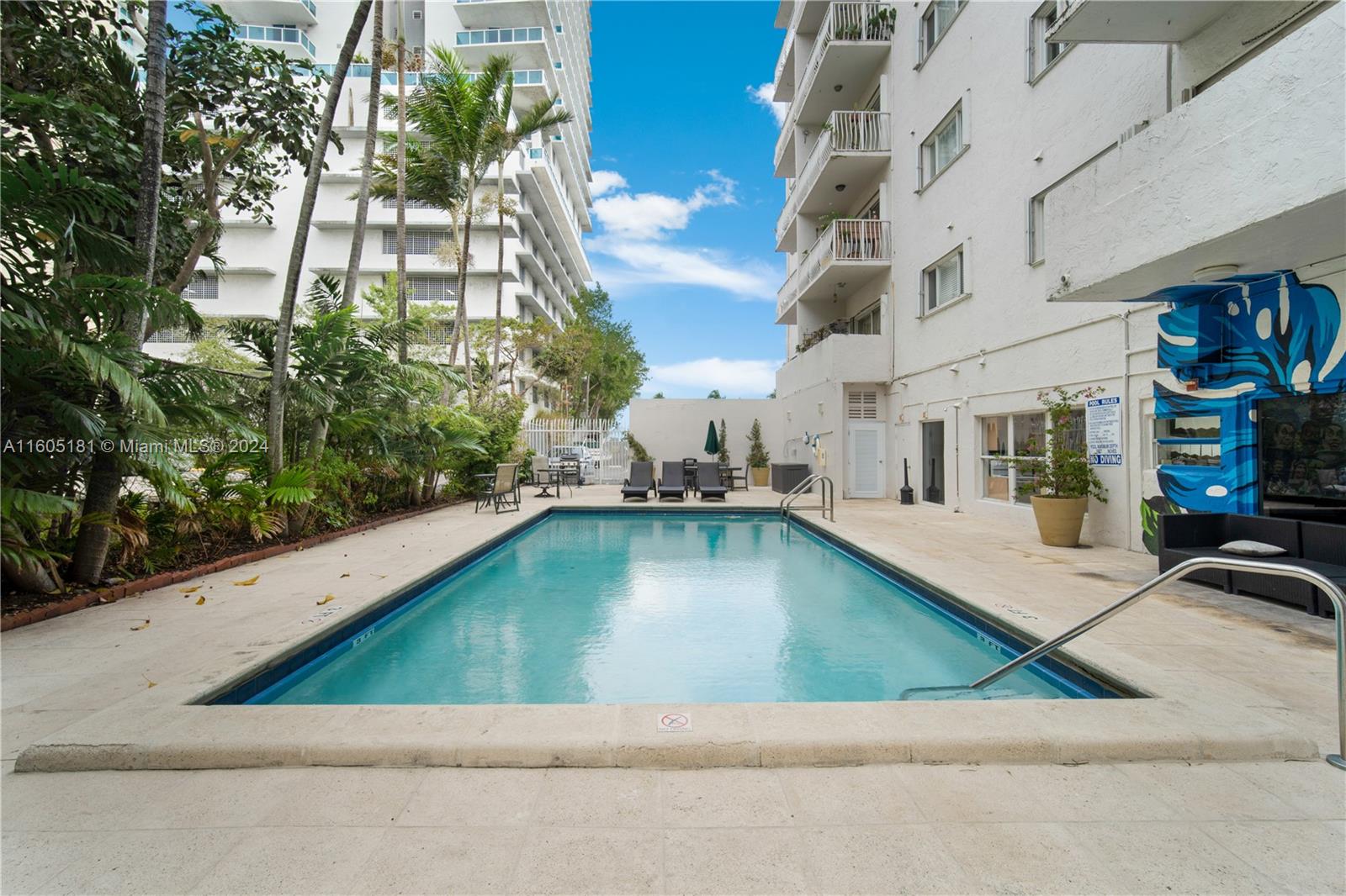 677 Northeast 24th Street, Unit 505 Miami, FL 33137 - Photo 23 of 30 a view of swimming pool with outdoor seating