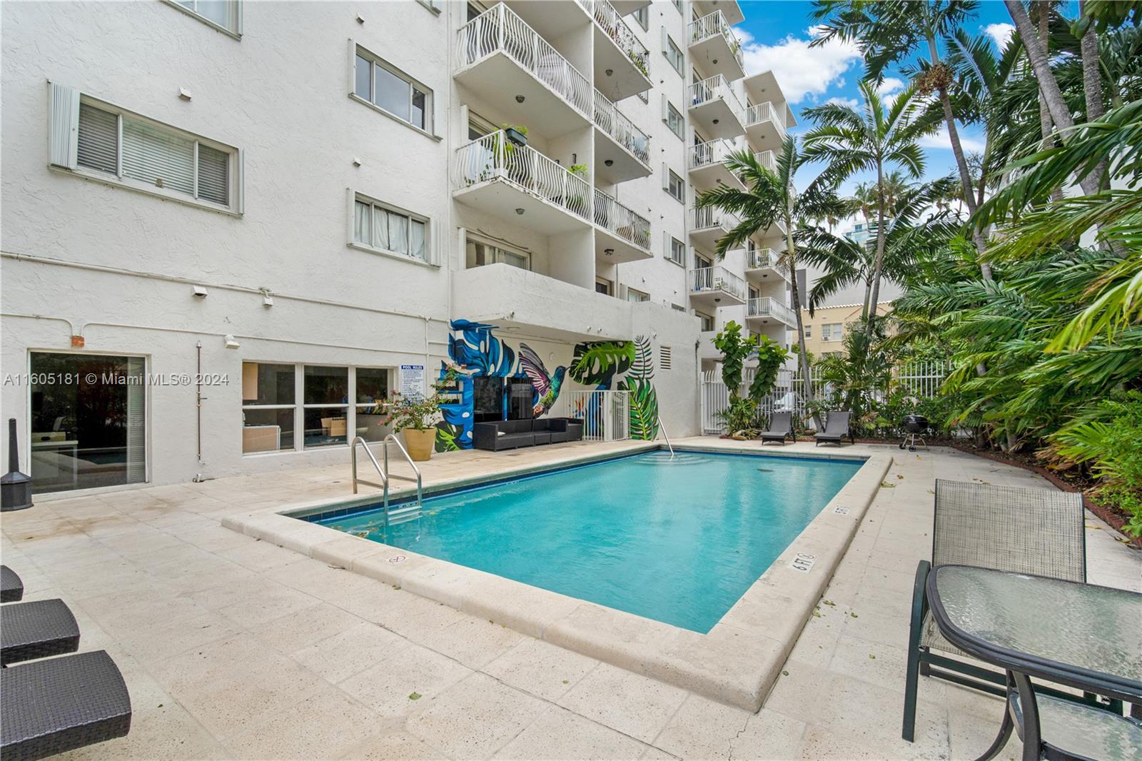 677 Northeast 24th Street, Unit 505 Miami, FL 33137 - Photo 24 of 30 a view of a swimming pool with a patio