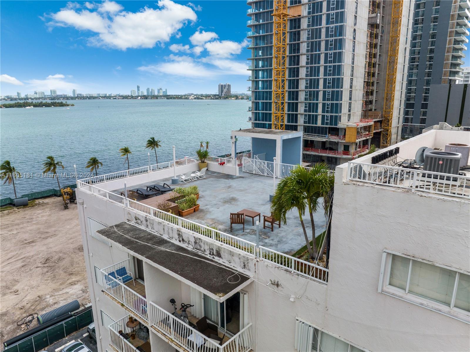 677 Northeast 24th Street, Unit 505 Miami, FL 33137 - Photo 27 of 30 a terrace with a table and chairs