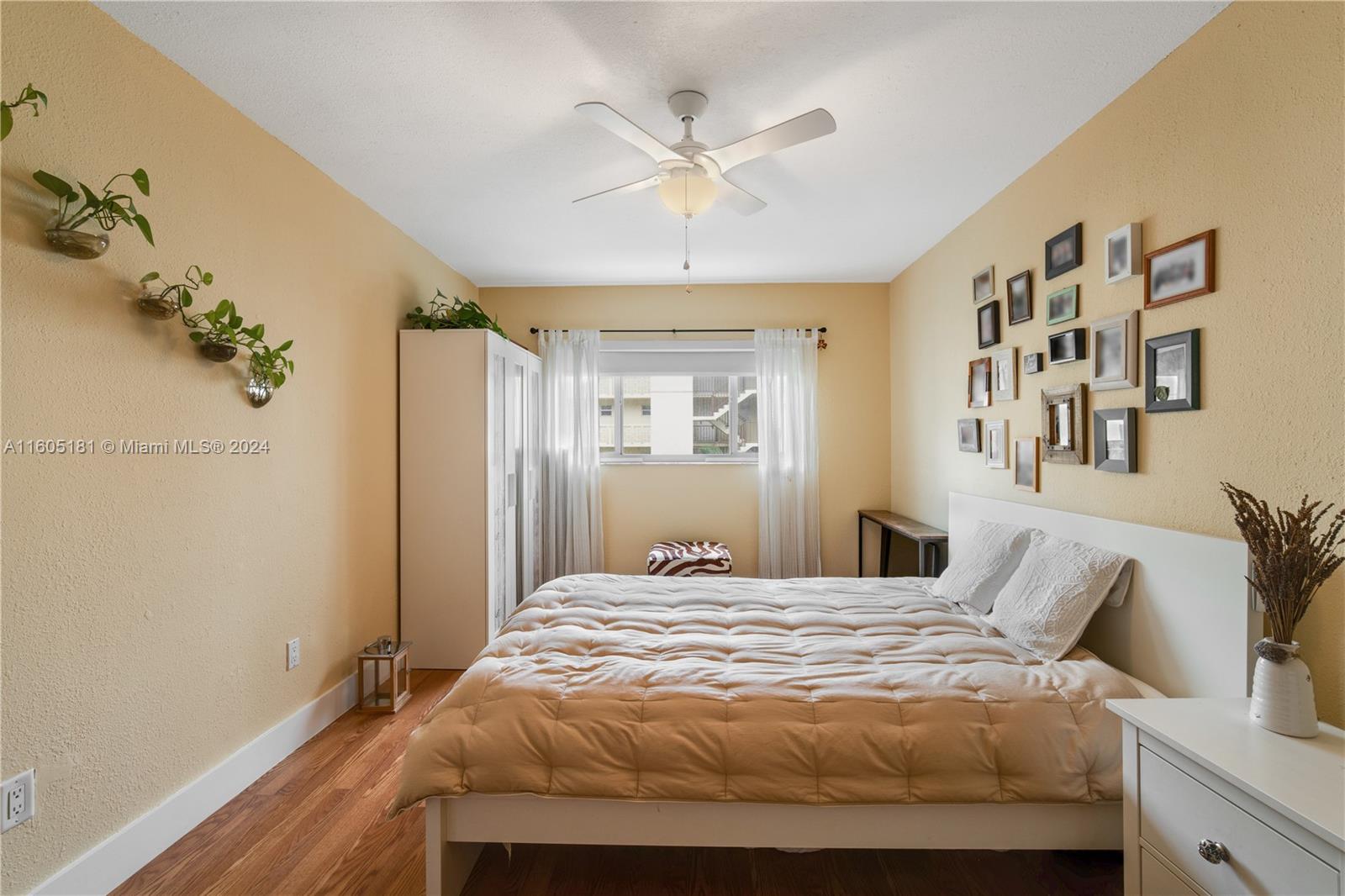 677 Northeast 24th Street, Unit 505 Miami, FL 33137 - Photo 8 of 30 a bedroom with a bed and a window
