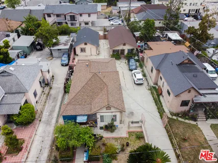 an aerial view of residential houses with outdoor space