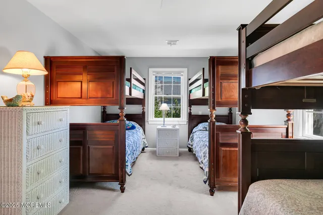 a bathroom with a sink toilet and a window