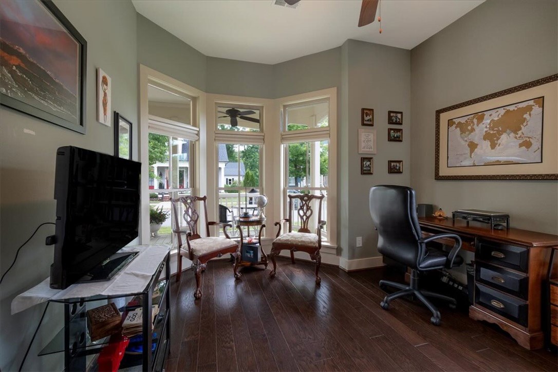 217 Pershing Avenue Clemson, SC 29631 - Photo 19 of 37 Elegant bedroom/office space featuring rich hardwood flooring and abundant natural light.