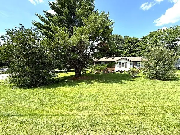 a house view with a garden space