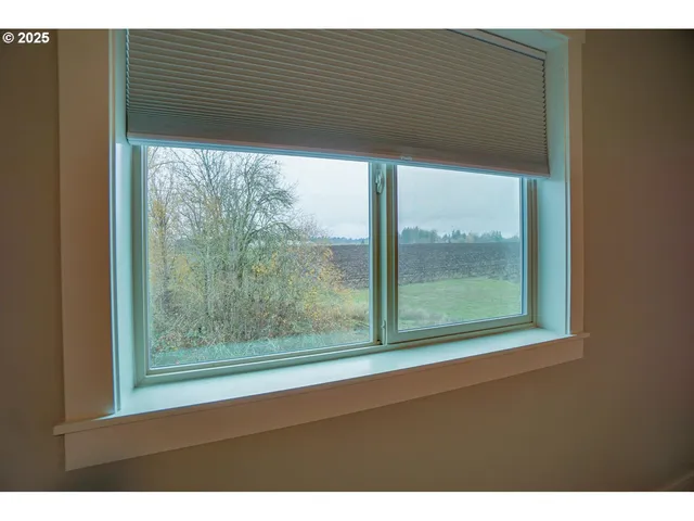 a bathroom with a granite countertop sink a mirror a vanity and a shower