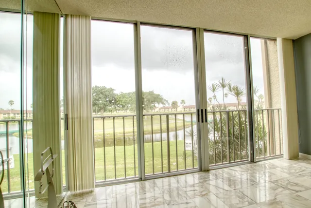 a view of a room that has a large window